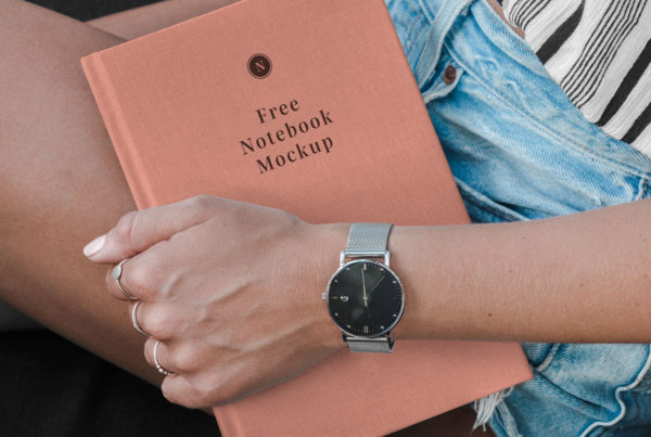 Hand Holding Notebook Mockup