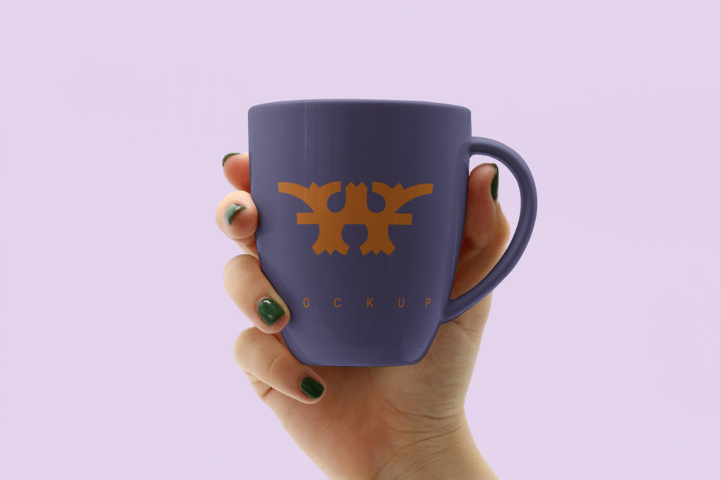 Hand Holding Mug Mockup
