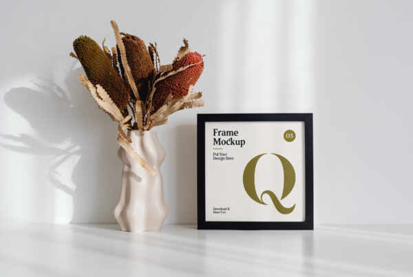 Frame with Flower on Desk Mockup