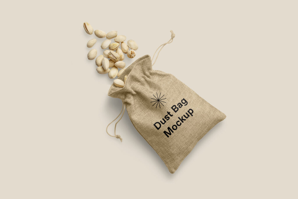 Seen from above, canvas Dust Bag Mockup with scattered peanuts on the beige floor.