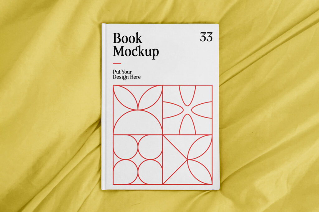 Seen from above, A4 Hard Cover Mockup laying on the yellow quilt.