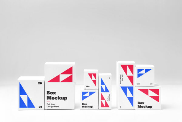 Front view, small paper Box Set Mockup arranged in compositions standing on floor in studio space.