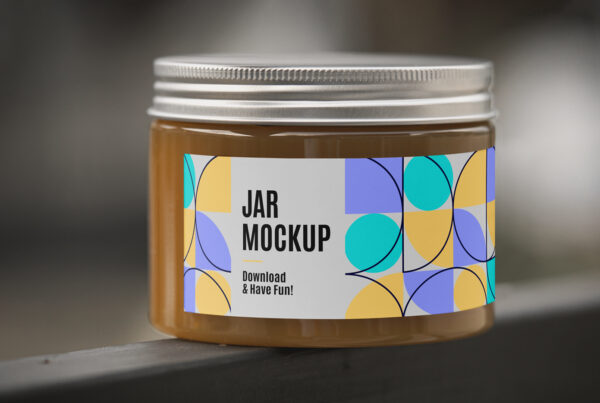 Front view, small Glass Jar Mockup with a long label standing on kitchen furniture.
