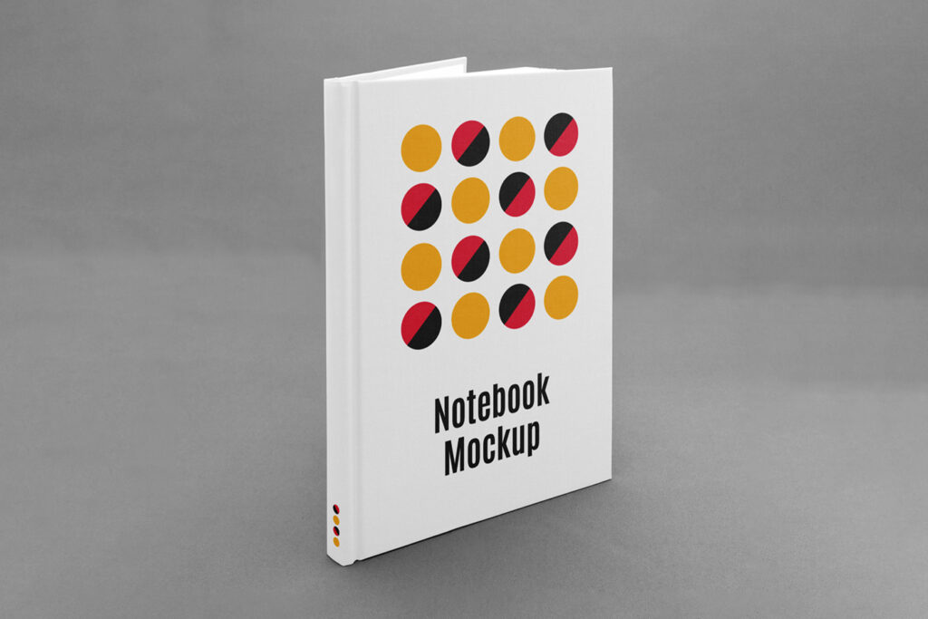 Front view, Notebook Cover PSD Mockup is standing on a concrete floor.