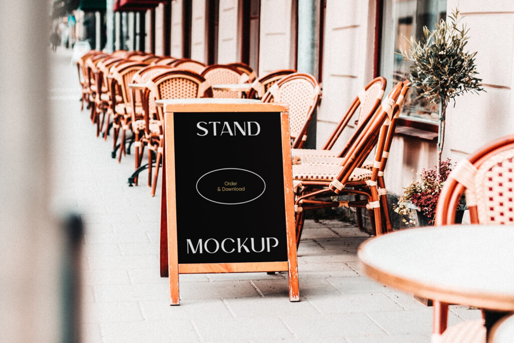 Simple Restaurant Stand Mockup with wooden frame standing on the street near the restaurant.