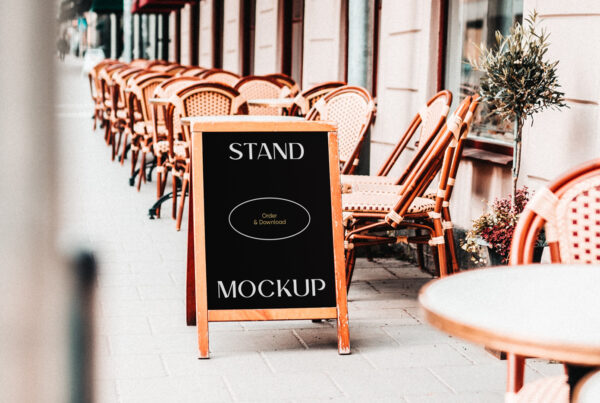 Simple Restaurant Stand Mockup with wooden frame standing on the street near the restaurant.