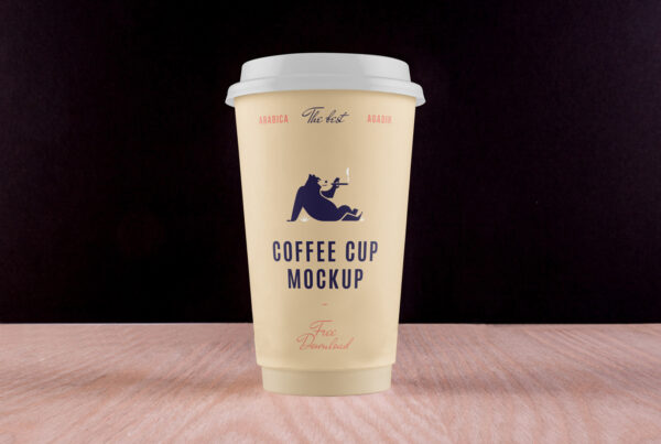 Front view, Big Coffee Cup on Desk Mockup against black background.