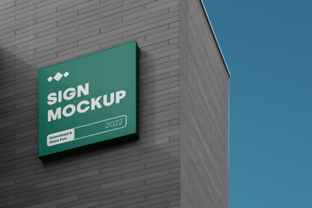Sign on the Building Mockup against on the blue sky view.