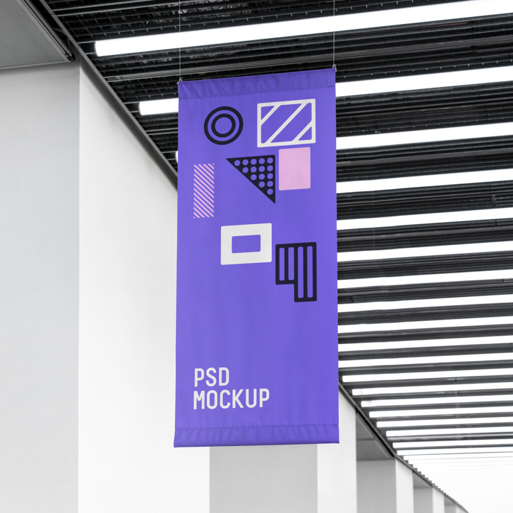 Vertical Flag Mockup hanging from the ceiling inside the building.