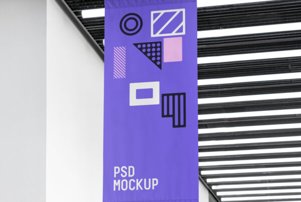 Vertical Flag Mockup hanging from the ceiling inside the building.
