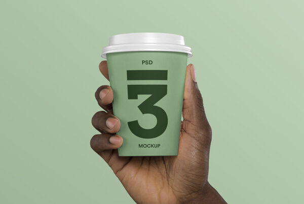 Front view, Hand Holding Coffee Cup Mockup on the green background.