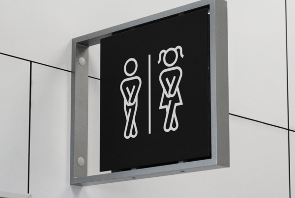 Black Indoor Sign Mockup in metal frame attached to the wall.