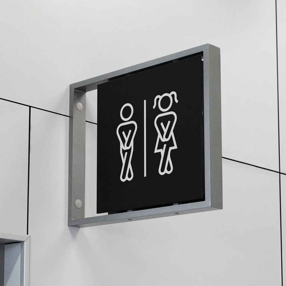 Black Indoor Sign Mockup in metal frame attached to the wall.