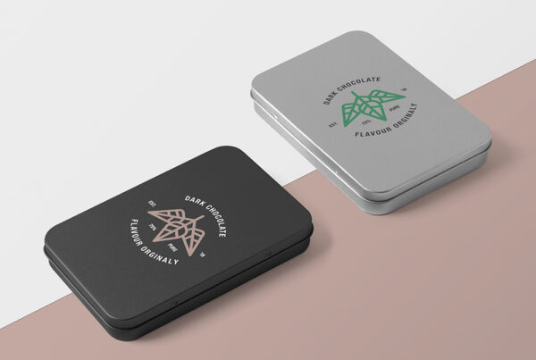 Two same Metal Boxes Mockup lies on the paper floor in two colors.