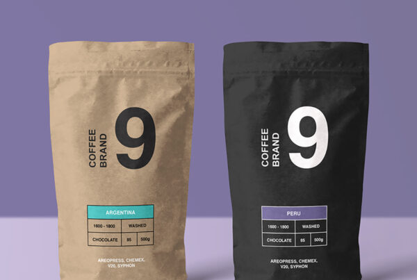 Front view, two same Paper Coffee Bag Mockups standing on the purple floor.