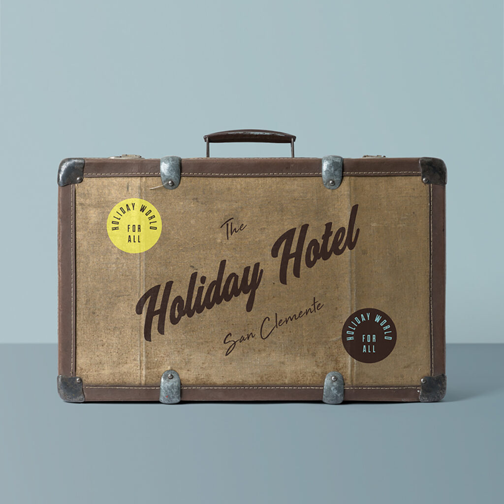 Front view, vintage Suitcase Mockup with metal and leather details standing in photography studio.