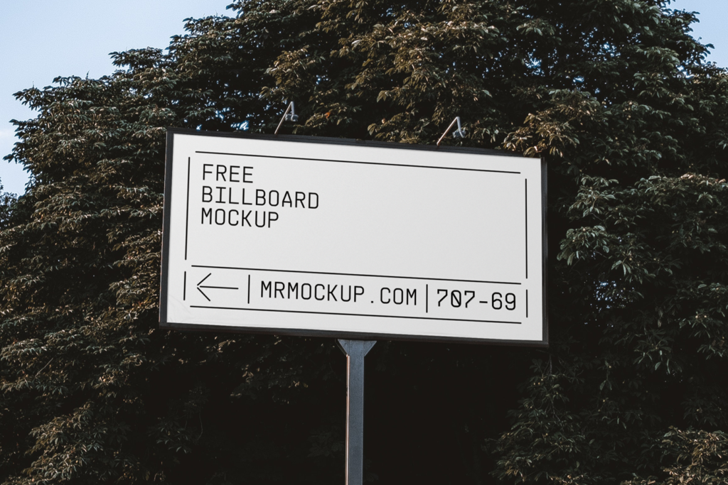 Wide Billboard in Park Mockup against the background of trees and blue sky.