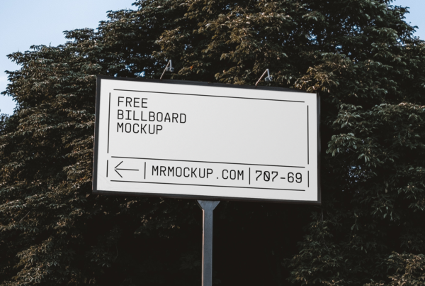 Wide Billboard in Park Mockup against the background of trees and blue sky.