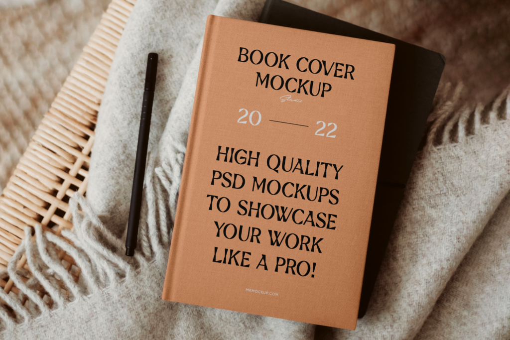 Hardcover Book PSD Mockup seen from above lie on blanket.