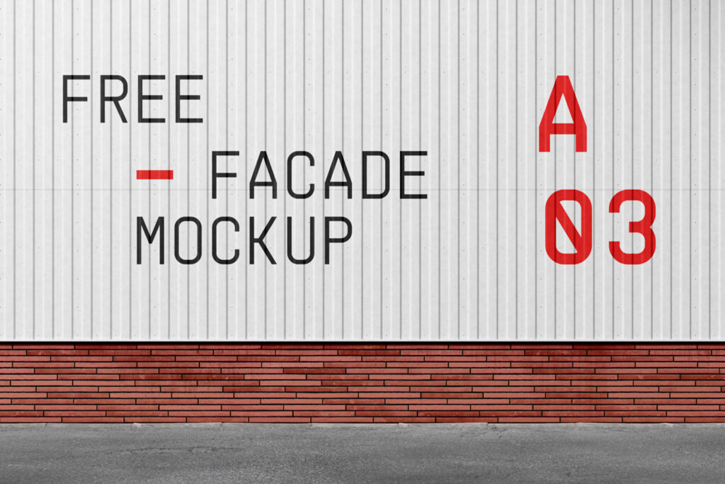 Front view, Metal Facade Mockup on a brick building next to a concrete road.