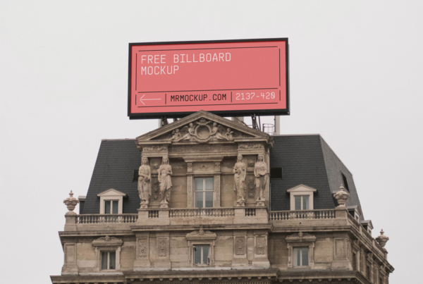 Wide Billboard on Tenement Mockup against the background of a cloudy day.