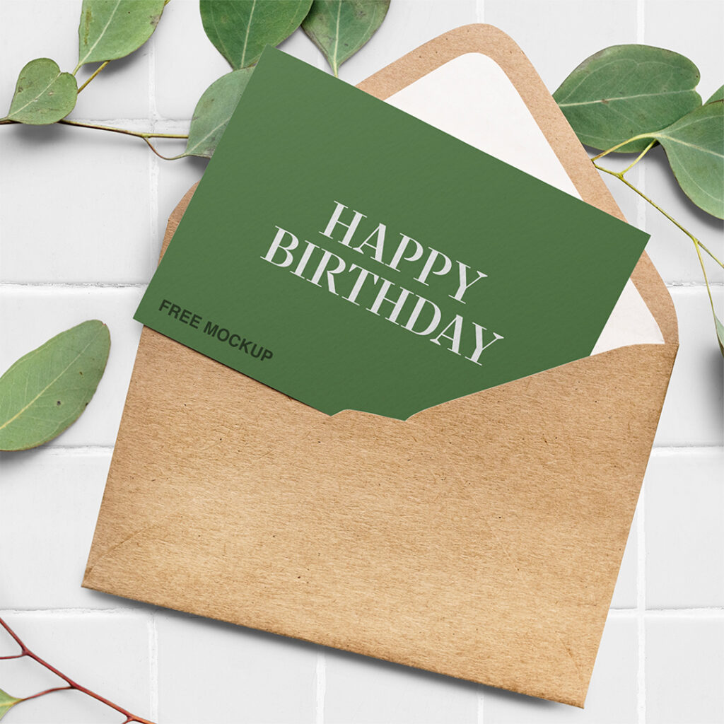 Elegant Greeting Card Mockup seen from above and lie with craft paper envelope on the white tiles.