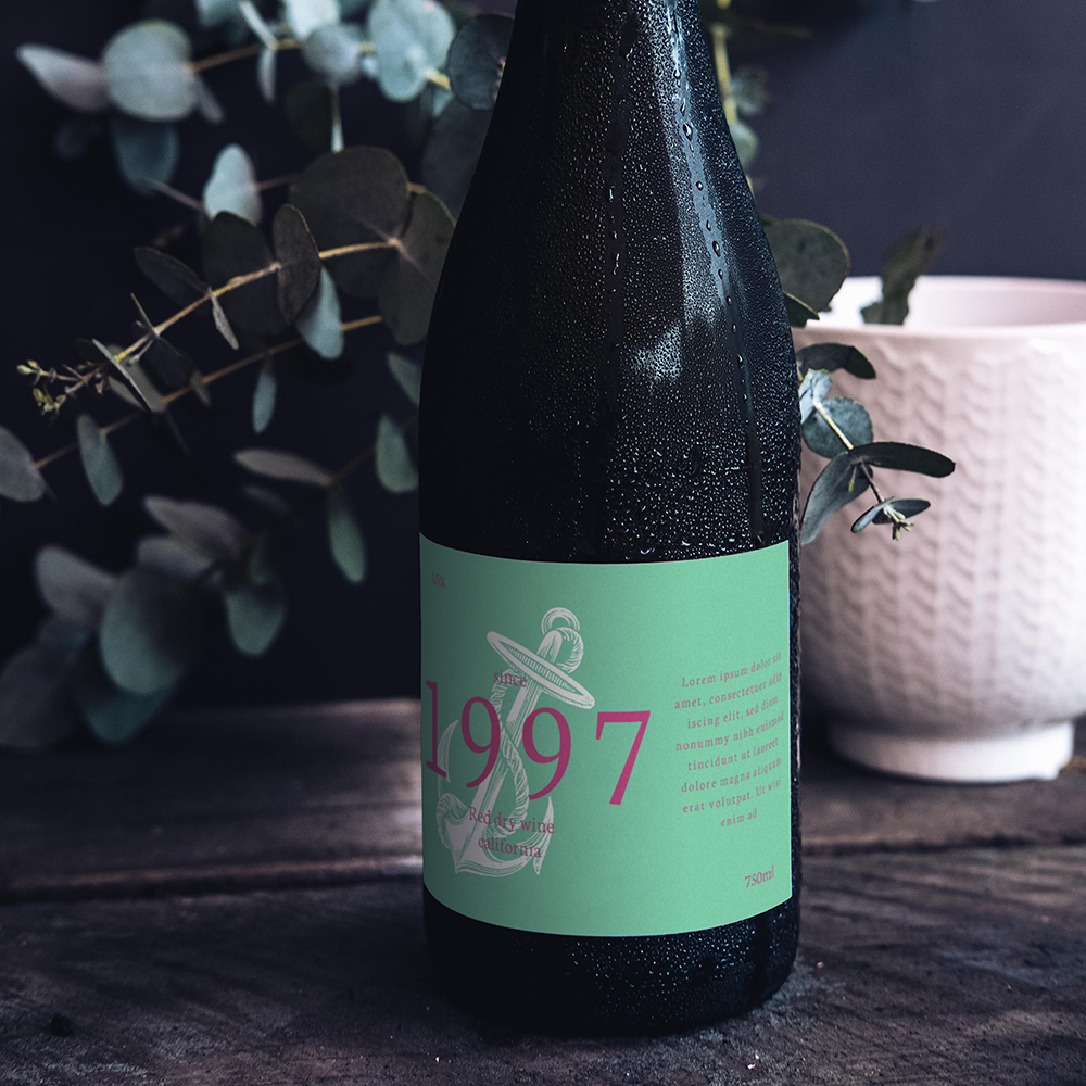 Glass Wine Bottle Mockup with paper label standing on the dark wood table.