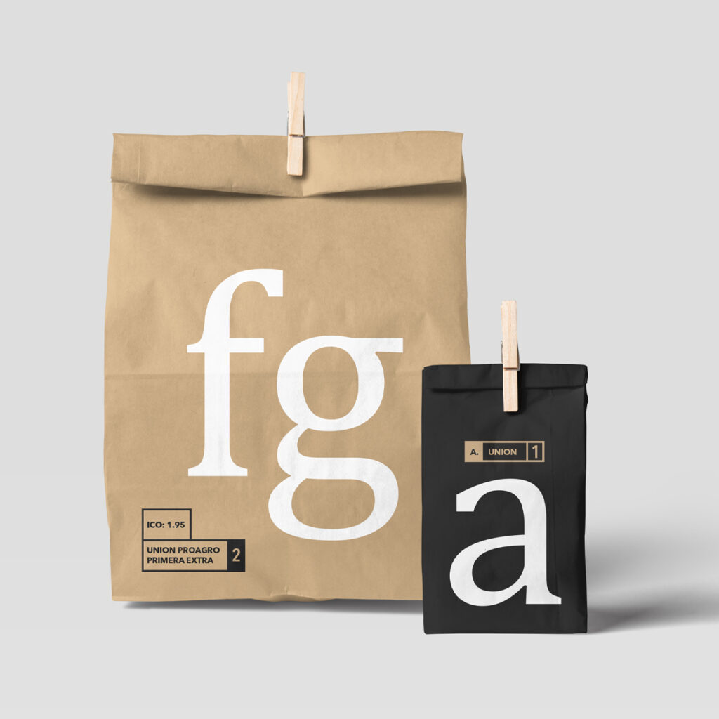 Front view, Two Paper Bag Mockups fastened with a wooden clip in studio.
