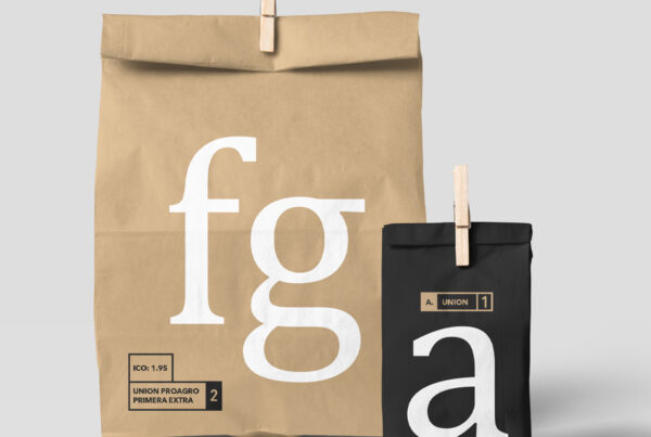 Front view, Two Paper Bag Mockups fastened with a wooden clip in studio.