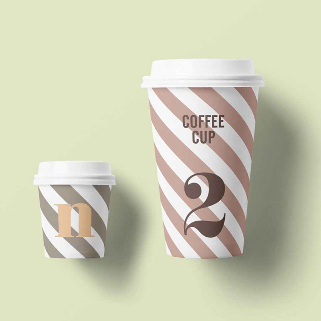 Two Paper Cup Mockups lies on the lime color floor.