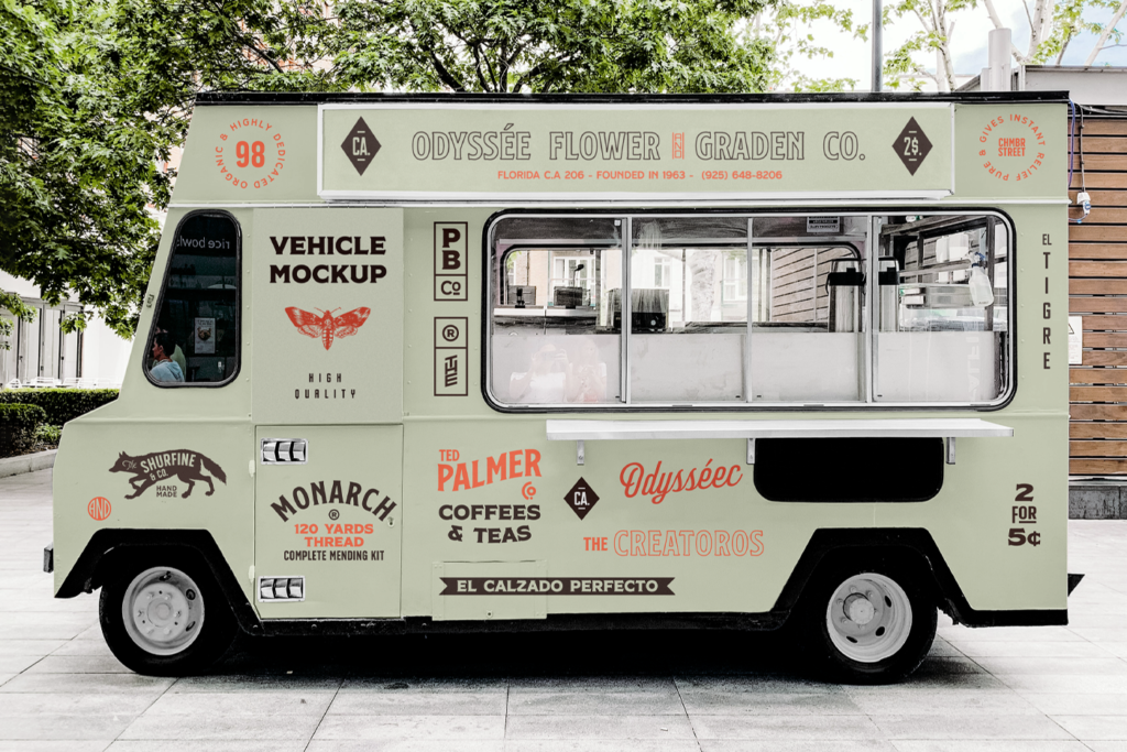 A Vehicle PSD Mockup is parked between buildings and trees.