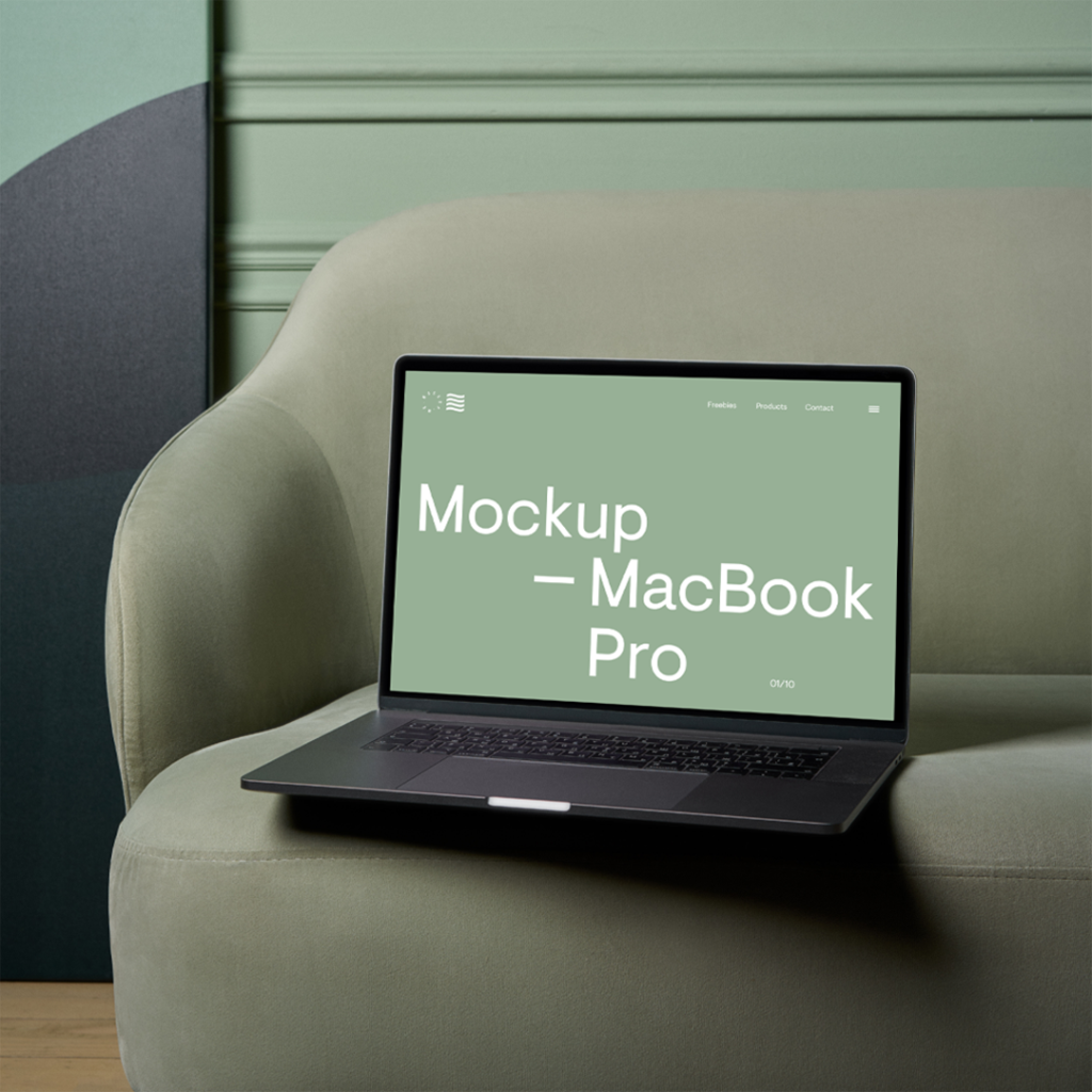 Open a MacBook Pro Mockup on the pastel green couch and wall behind.