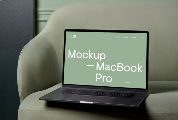 Open a MacBook Pro Mockup on the pastel green couch and wall behind.