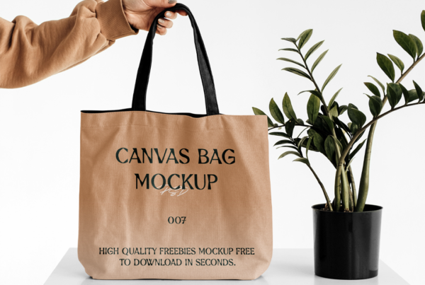 Women Holding Big Canvas Bag Mockup which standing on the white looker near flower.