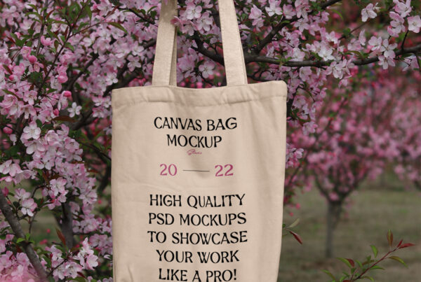 Hanging canvas bag mockup on the fruit tree seen from the front.