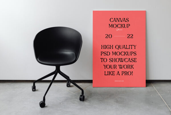 B2 canvas mockup leaning against a wall in a studio with a black work chair.