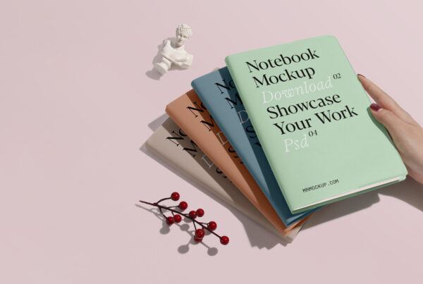 Four notebooks mockup placed on top of each other on the floor.