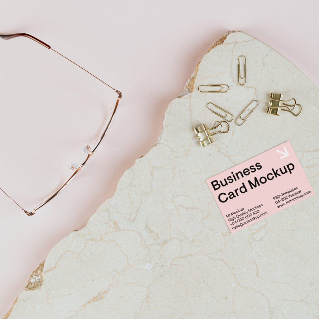 Business card mockup lying on a piece of marble.