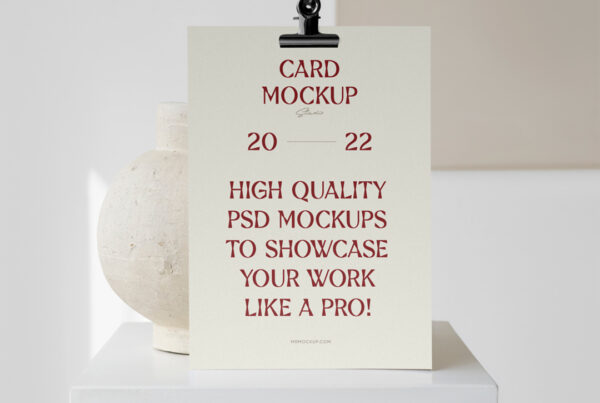Card mockup standing on the white cubic with vase behind.
