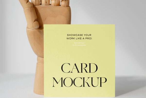 Card mockup with a standing wooden hand at the back.