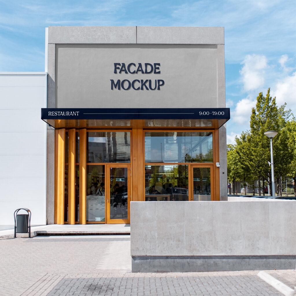A concrete building facade mockup seen from the front with trees.