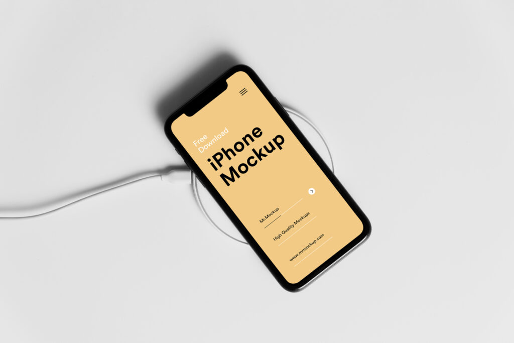 iPhone Pro mockup lies on the charger on the white floor.