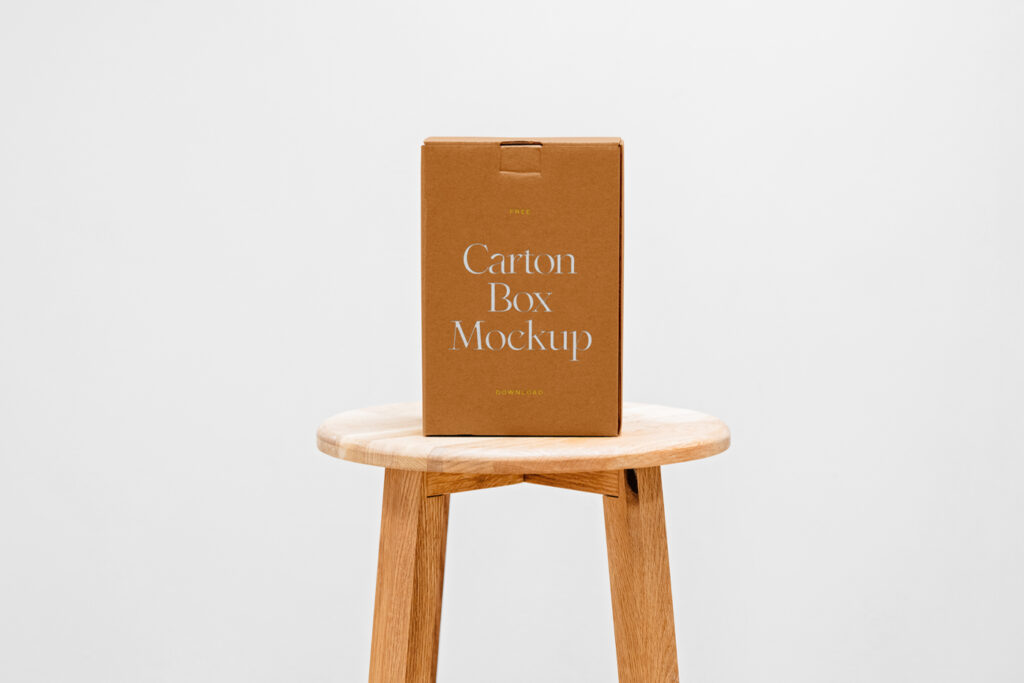 A cardboard box mockup standing on a wooden chair.