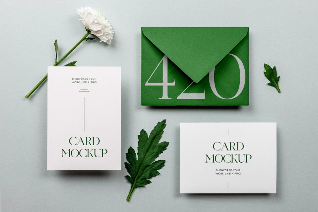 A mini stationery set mockup lies on the floor with plants.