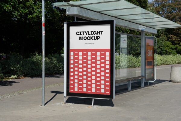 City light poster mockup with a red design on a bus stop.