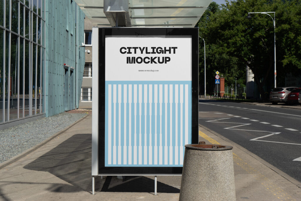 City light poster mockup with a blue design on a bus stop.