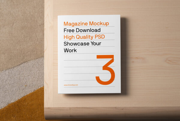 A magazine mockup laying on a bright wood table is seen from above.
