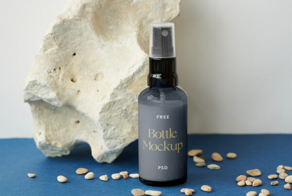 Bottle mockup with rock on the blue floor.
