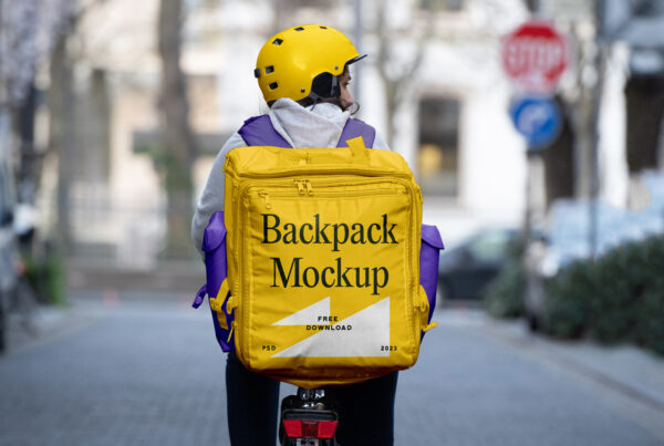 Woman wearing helmet and delivery backpack when riding bicycles.