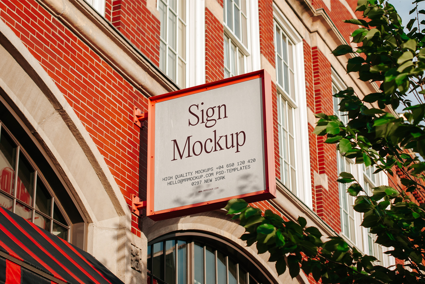 Big metal square sign mockup on the facade of a brick building.